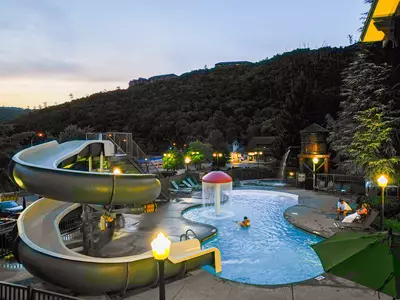 outdoor pool and slide at night
